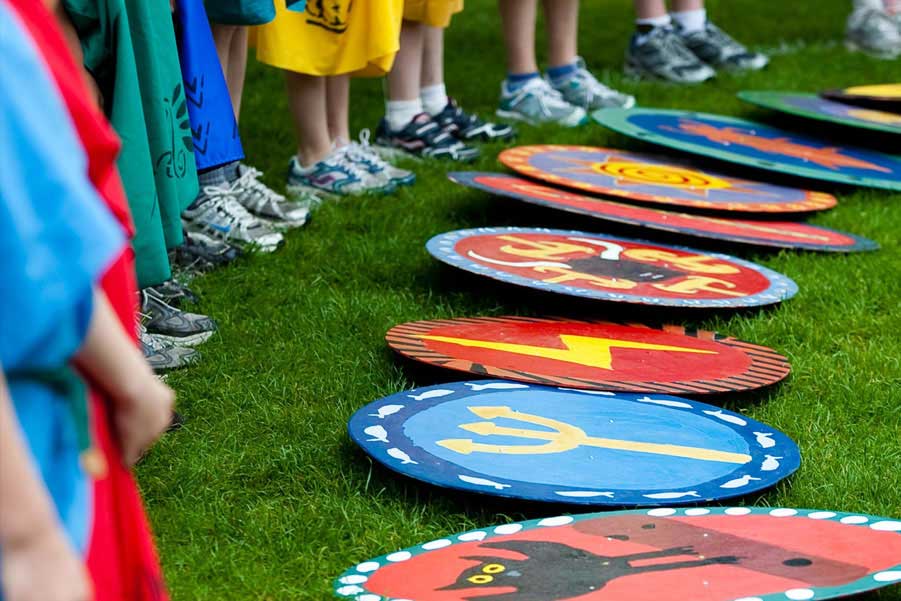 Kids listening to a book being read by the teacher